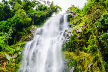 View of Materuni waterfall at foot of mountain Kilimanjaro not far from the city Moshi, Tanzania - obrazy, fototapety, plakaty