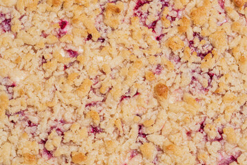 Cake surface with crumbles, image from above, concept for dessert