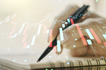 Creative concept of crisis chart illustration with hand writing in notebook on background. Global crisis and bankruptcy concept. Multiexposure