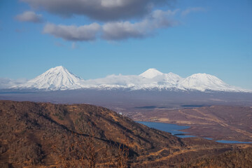 Fototapeta premium Snow covered volcanoes of Kamchatka