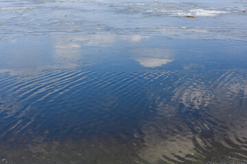 Ice floes float on the surface of the sea or river. Ice drift. Global warming, climate change. Environmental concept.
