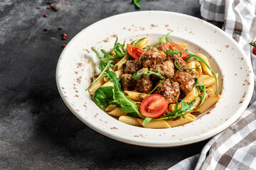 Meatball penne pasta with spicy tomato sauce. Restaurant menu, dieting, cookbook recipe banner,...