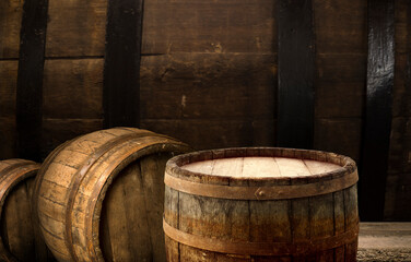 Fototapeta premium background of barrel and worn old table of wood