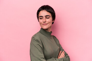 Fototapeta premium Young caucasian woman isolated on pink background laughing and having fun.
