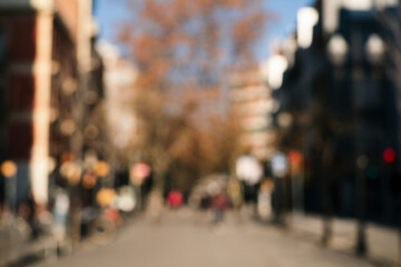 Natural bokeh of city cantre view, blurred out of focus background. Abstract beautiful backdrop for...