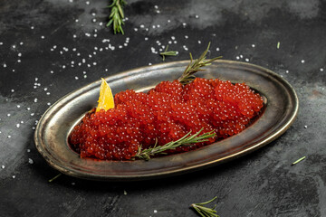 Delicious red caviar in vintage plate, Gourmet food close up, appetizer, selective focus, place for text