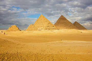 The Great Pyramids of Giza (three small pyramids, known as Pyramids of Queens on the front side;...