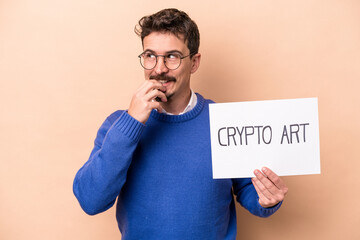 Young caucasian man holding a crypto art placard isolated on beige background relaxed thinking about something looking at a copy space.