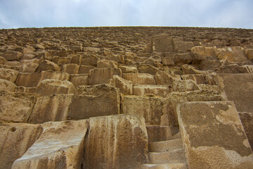 Obraz premium The Great Pyramid Khufu (or Pyramid of Cheops) is the oldest and largest of the three pyramids in the Giza pyramid complex, the oldest of the Seven Wonders of the Ancient. Cairo, Egypt