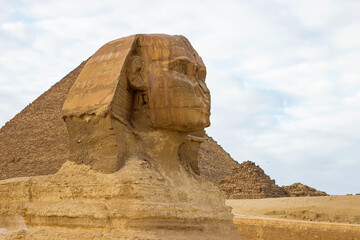 Closeup photo of Sphinx, ancient Egyptian limestone statue of a mythical creature with a lion's...