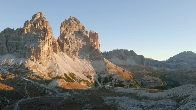 4k drone flight moving to the side footage (Ultra High Definition) of of Tre Cime Di Lavaredo Peaks. Fantastic autumn view of Dolomite Alps, Italy, Europe. Full HD video (High Definition).