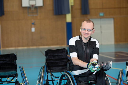 Sportsman in wheelchair in gym