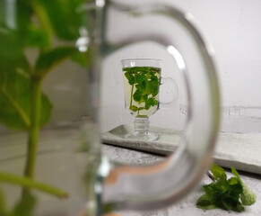 mint tea in a transparent mug