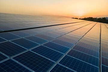 Blue photovoltaic solar panels mounted on building roof for producing clean ecological electricity...