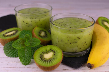 Refreshing kiwi banana smoothie with mint. Close-up.	