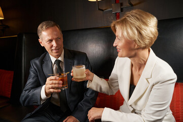 Joyous colleagues having fun night after busy work day