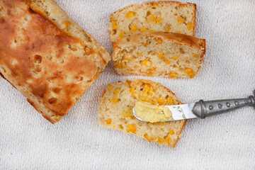 Mielie bread, a South African bread with whole sweetcorn on rustic  kitchen table