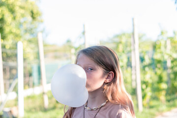 big bubble from chewing gum and child - obrazy, fototapety, plakaty