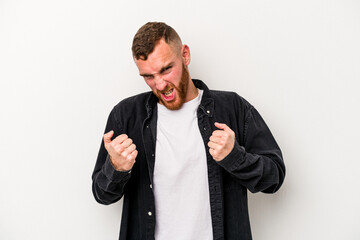 Young caucasian man isolated on white background upset screaming with tense hands.