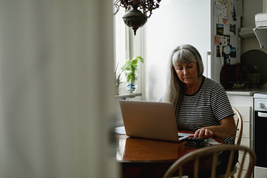 Senior woman using laptop