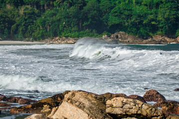 Rocks and Waves on the beach of the north coast of Sao Paulo, Brazil