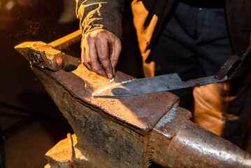 Forging molten metal. Making knives. forge workshop