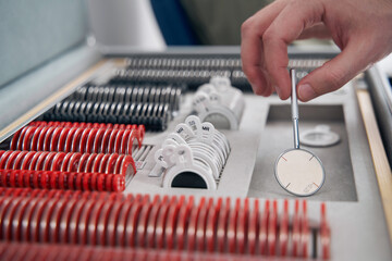 Doctor using ophthalmic trial spectacle lens sets