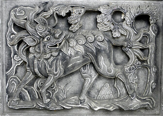 Ancient stone carvings seen on the walls of temples in Taiwan, carvings of historical stories. The...