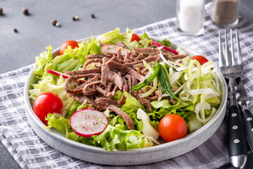Delicious beef tongue salad on a plate.