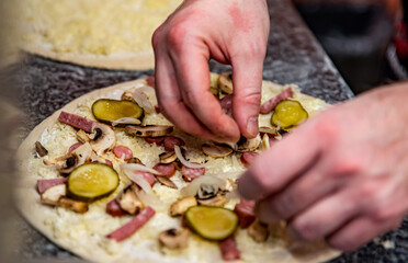 hand of chef baker making pizza at kitchen. The process of making pizza. cooking italian pizza