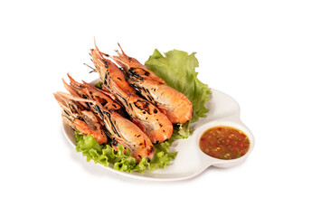 grilled shrimp on a plate served with spicy sauce