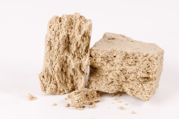 two pieces of halva on a white background