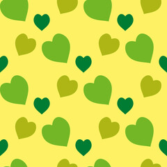 Seamless pattern with green hearts on light yellow background. Vector image.