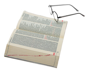 Glasses lying on the Bible in Polish isolated on a white background