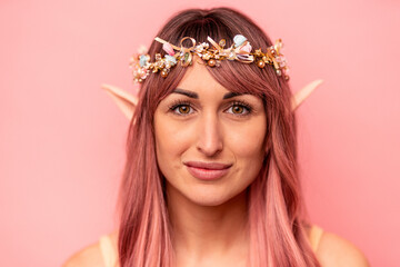 Young caucasian elf woman isolated on pink background