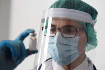 Professional medical doctor in hospital office. Portrait of young and confident physician. Medical...