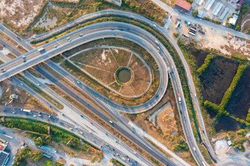 Aerial top view of elevated road and traffic. Modern construction design of traffic ways to avoid traffic jams