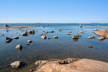 View of the Gulf of Finland and stones in the water, Lauttasaari island, Finland