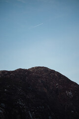 airplane flying over the mountains Langfossen Norway