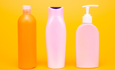 Wonderful daily necessities for you. Plastic packaging bottles. Cosmetic bottles yellow background