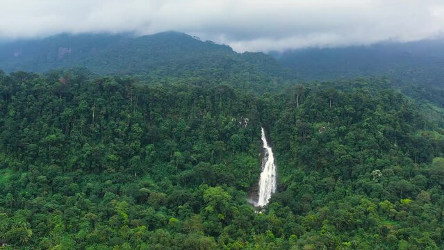 Mapalana Falls in green forest. Waterfall in the tropical mountain jungle. Sri Lanka.