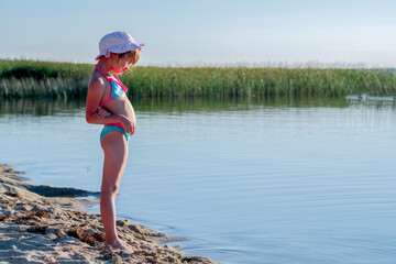 Beautiful panorama of sea and young cute girl playing in sea. Summer, holiday, happiness and...