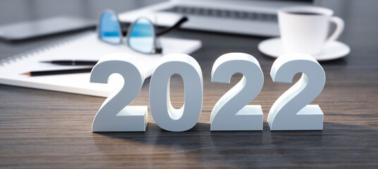 Numbers of the year 2022 standing on office desktop