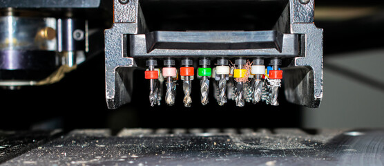 drill bits in the tray of the automatic numerical machine