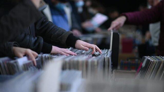 Man hands browsing vinyl album in a record store