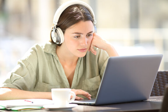 Student e-learning online with headset and laptop
