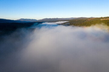 Aerial view of misty morning in the mountains