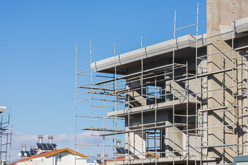 Close-up of the construction of a stone building. Construction of a new building in formwork