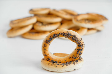 Dried bagels with poppy seeds on a white background