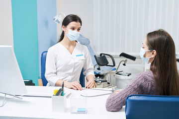 Fototapeta premium Professional Caucasian female gynecologist consulting young woman